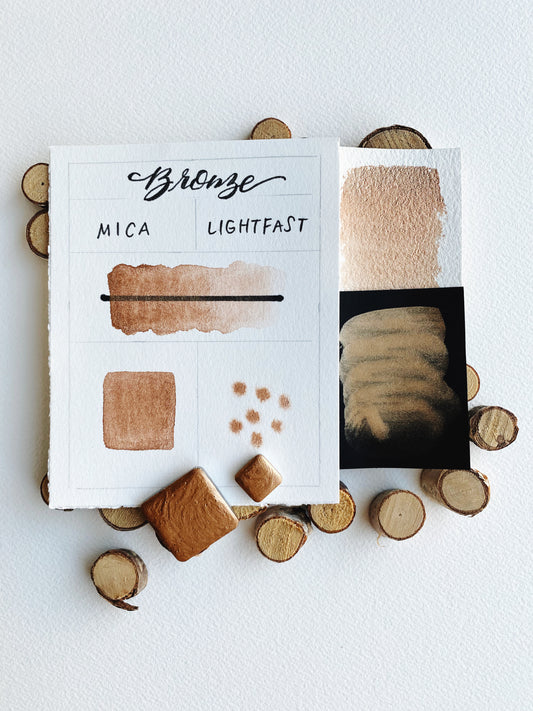 Handmade Bronze watercolor pan — warm metallic bronze pigment with shimmer in metal pan.