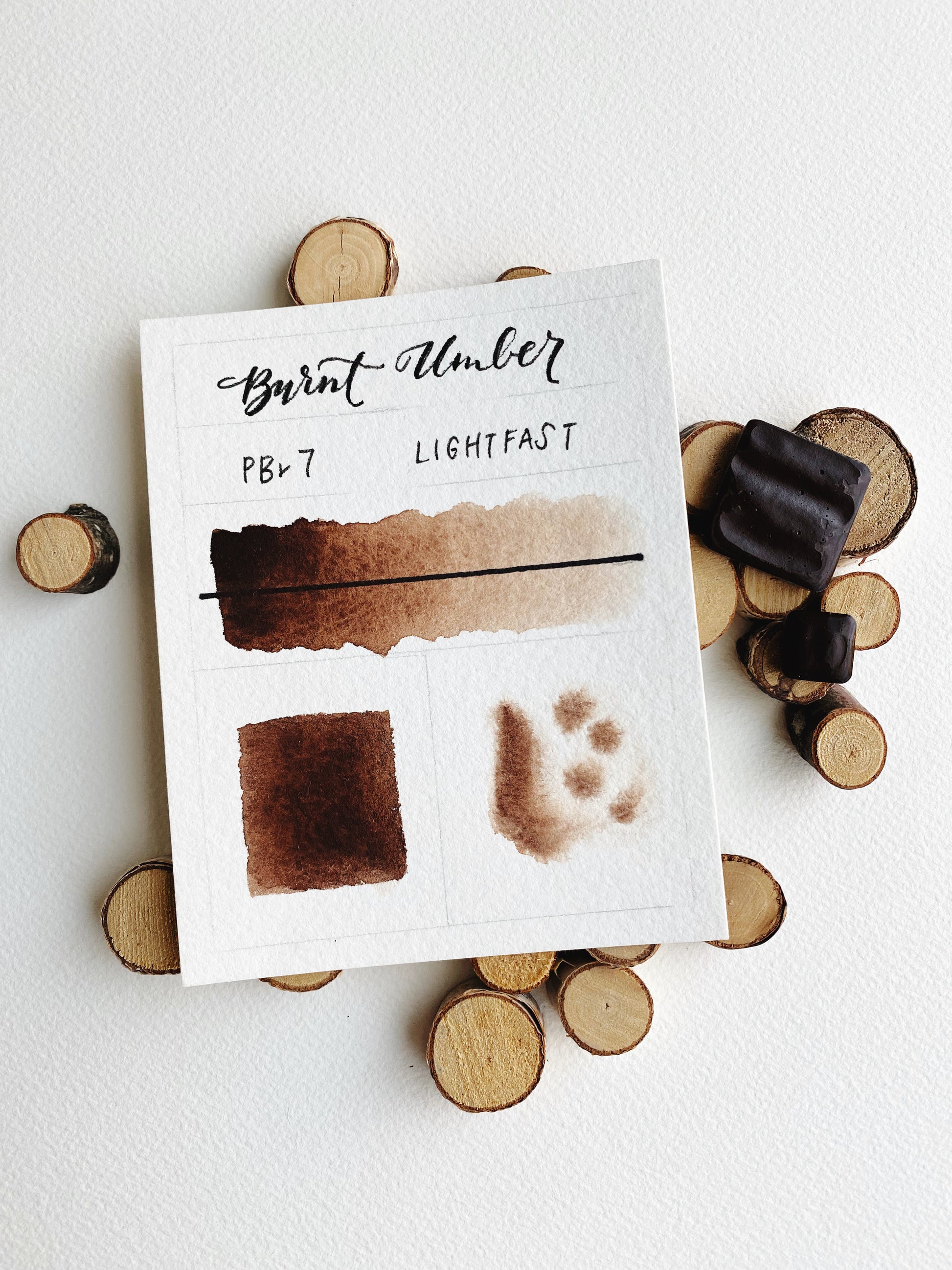 Handmade Burnt Umber watercolor pan — warm earth-brown pigment in metal pan.
